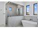 Large walk-in shower with marble surround, soaking tub and black hardware with windows at 3933 E Freeman Ln, San Tan Valley, AZ 85140