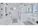 Modern bathroom with glass shower enclosure and freestanding soaking tub at 3933 E Freeman Ln, San Tan Valley, AZ 85140