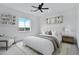 Bright bedroom features a ceiling fan, large window with a view, and modern decor at 3933 E Freeman Ln, San Tan Valley, AZ 85140