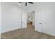 Bright bedroom featuring wood-look floors and a view to the kitchen at 3933 E Freeman Ln, San Tan Valley, AZ 85140