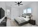 Serene bedroom features a ceiling fan, plush rug, and views of the outdoors at 3933 E Freeman Ln, San Tan Valley, AZ 85140