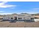 Stunning single-story home with white siding, dark trim, and desert landscaping at 3933 E Freeman Ln, San Tan Valley, AZ 85140