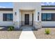 A charming front entrance features stone accents, and a walkway with a front door at 3933 E Freeman Ln, San Tan Valley, AZ 85140