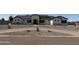 A charming single-Gathering home with modern farmhouse architecture and a well-manicured gravel front yard at 3933 E Freeman Ln, San Tan Valley, AZ 85140