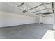Large garage with a bright overhead lights and plenty of room for parking and storage at 3933 E Freeman Ln, San Tan Valley, AZ 85140