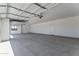 Spacious garage with overhead lights, room for storage and a side entrance to the interior at 3933 E Freeman Ln, San Tan Valley, AZ 85140