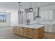 Beautiful kitchen featuring an island with quartz countertops, subway tile backsplash, and pendant lighting at 3933 E Freeman Ln, San Tan Valley, AZ 85140