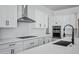 Kitchen features stainless steel appliances, modern hood and subway backsplash at 3933 E Freeman Ln, San Tan Valley, AZ 85140