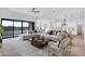 Bright, open-concept living area with modern furnishings and desert views at 3933 E Freeman Ln, San Tan Valley, AZ 85140