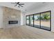 Light and bright living room featuring a brick fireplace and sliding glass doors to the backyard at 3933 E Freeman Ln, San Tan Valley, AZ 85140