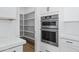 A double oven built into the cabinetry with pantry nearby at 3933 E Freeman Ln, San Tan Valley, AZ 85140