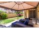 Relaxing backyard with covered patio, outdoor seating, and lush greenery at 4061 E Torrey Pines Ln, Chandler, AZ 85249