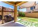 Inviting backyard featuring a covered patio with seating and built-in grill at 4061 E Torrey Pines Ln, Chandler, AZ 85249