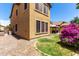 Spacious backyard with mature landscaping and view of the home's exterior at 4061 E Torrey Pines Ln, Chandler, AZ 85249