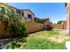Well-maintained backyard with lush grass, privacy fence, and mature landscaping at 4061 E Torrey Pines Ln, Chandler, AZ 85249