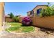 Lush backyard featuring green grass, brick walls, and mature landscaping at 4061 E Torrey Pines Ln, Chandler, AZ 85249