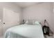 Bright bedroom showcases a cozy bed, side table and closet for storage solutions at 4061 E Torrey Pines Ln, Chandler, AZ 85249