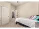 Cozy bedroom with a twin bed and view of the bathroom, creating a convenient ensuite feel at 4061 E Torrey Pines Ln, Chandler, AZ 85249