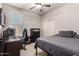 Comfortable bedroom with a window view, closet and desk space for optimal living at 4061 E Torrey Pines Ln, Chandler, AZ 85249