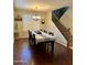 Inviting dining room featuring hardwood floors and a staircase with wrought iron at 4061 E Torrey Pines Ln, Chandler, AZ 85249