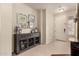 Stylish entryway featuring decorative console table and neutral decor at 4061 E Torrey Pines Ln, Chandler, AZ 85249