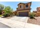 Beautiful two-story home with a concrete driveway and well manicured landscaping at 4061 E Torrey Pines Ln, Chandler, AZ 85249