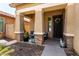 Inviting front porch with textured columns and cozy seating with a desert motif at 4061 E Torrey Pines Ln, Chandler, AZ 85249