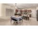 Charming kitchen featuring stainless steel appliances, granite countertops, and a sociable central island with bar seating at 4061 E Torrey Pines Ln, Chandler, AZ 85249