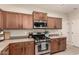Contemporary kitchen showcases stainless steel appliances, granite countertops, and ample cabinet space at 4061 E Torrey Pines Ln, Chandler, AZ 85249