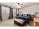 Comfortable main bedroom with ceiling fan, carpet, and great natural lighting at 4061 E Torrey Pines Ln, Chandler, AZ 85249