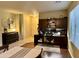 Spacious home office featuring a large desk and shelving and an adjacent dining space at 4061 E Torrey Pines Ln, Chandler, AZ 85249