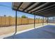 Spacious covered back patio with ample space for outdoor seating and entertaining, showcasing the expansive fenced backyard at 4209 N 48Th Dr, Phoenix, AZ 85031