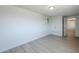 Spacious bedroom features painted brick walls, light wood floors, and a closet at 4209 N 48Th Ave, Phoenix, AZ 85031