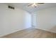 Neutral bedroom with luxury vinyl plank flooring and bright white walls at 4209 N 48Th Dr, Phoenix, AZ 85031