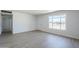 Spacious living room with luxury vinyl plank flooring and bright natural lighting at 4209 N 48Th Ave, Phoenix, AZ 85031