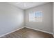 This charming bedroom has wood floors and lots of light from the large window at 4343 N 21St St # 213, Phoenix, AZ 85016