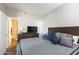 Relaxing bedroom with soft lighting, a comfortable bed, and a well-placed dresser at 4343 N 21St St # 213, Phoenix, AZ 85016