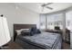 Serene bedroom with ample natural light, a ceiling fan, and a dedicated workspace at 4343 N 21St St # 213, Phoenix, AZ 85016