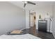 This charming bedroom has wood floors and a view to the laundry room at 4343 N 21St St # 213, Phoenix, AZ 85016