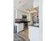 Modern kitchen with stainless steel appliances, granite countertops, and sleek white cabinetry at 4343 N 21St St # 213, Phoenix, AZ 85016