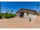 Exterior view of the Lakeside Clubhouse with desert landscaping and ample parking at 45 Leisure World -- # 45, Mesa, AZ 85206