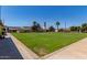 Expansive community lawn features a lush green space for recreation and relaxation at 45 Leisure World -- # 45, Mesa, AZ 85206