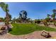 Leisure World entrance features a unique globe statue and beautifully landscaped grounds at 45 Leisure World -- # 45, Mesa, AZ 85206