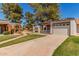 Attractive single-Gathering home with a cozy front patio, grassy lawn, and a two-car garage at 45 Leisure World -- # 45, Mesa, AZ 85206
