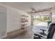 Spacious garage with an open door, shelving, and room for parking at 45 Leisure World -- # 45, Mesa, AZ 85206