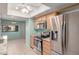 Well-equipped kitchen featuring modern stainless steel appliances, ample countertop space, and wooden cabinets at 45 Leisure World -- # 45, Mesa, AZ 85206