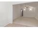 Bright living room with neutral carpeting and a ceiling fan at 45 Leisure World -- # 45, Mesa, AZ 85206