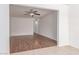 Bright living room featuring wood-look flooring and a modern ceiling fan at 45 Leisure World -- # 45, Mesa, AZ 85206