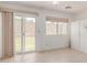 Sunlit living space with a sliding glass door that opens to the backyard patio at 45 Leisure World -- # 45, Mesa, AZ 85206