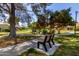 Inviting community park featuring benches, walking paths, and lush greenery at 45 Leisure World -- # 45, Mesa, AZ 85206